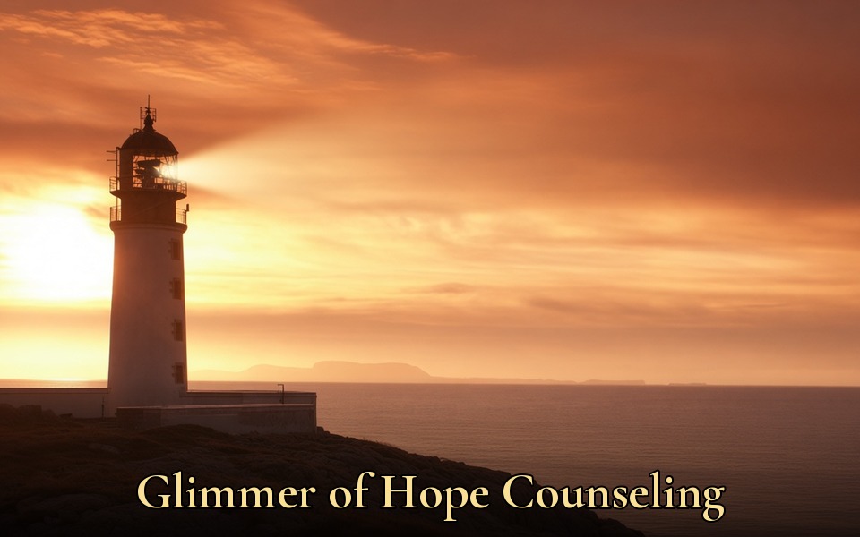 Glimmer of Hope Counseling: a lighthouse at sunrise sending a beam of light across the sea